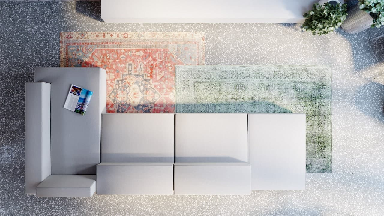 This is a top view of the large L-shaped sectional sofa adorned by the colorful area rugs underneath.