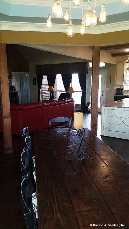 The dining area overlooks the living room and open kitchen.