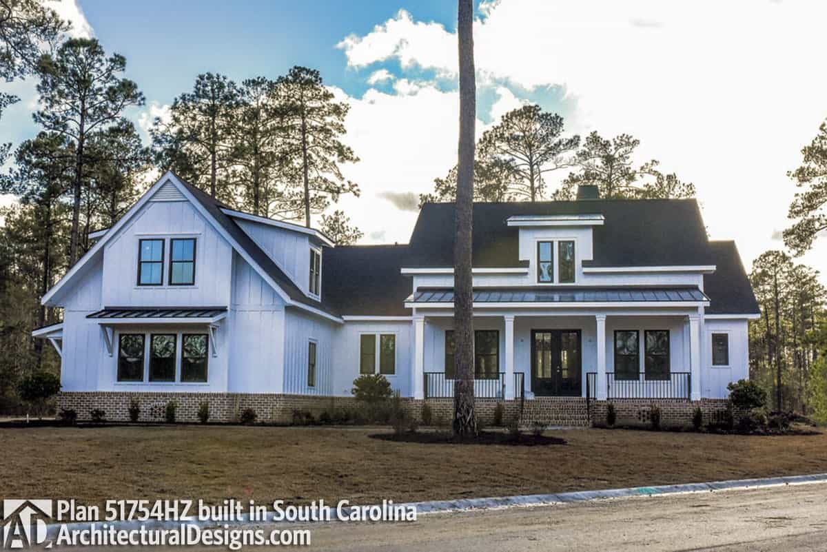 Same layout with the previous one. It also includes a shed dormer and wrought iron railings framing the front porch.