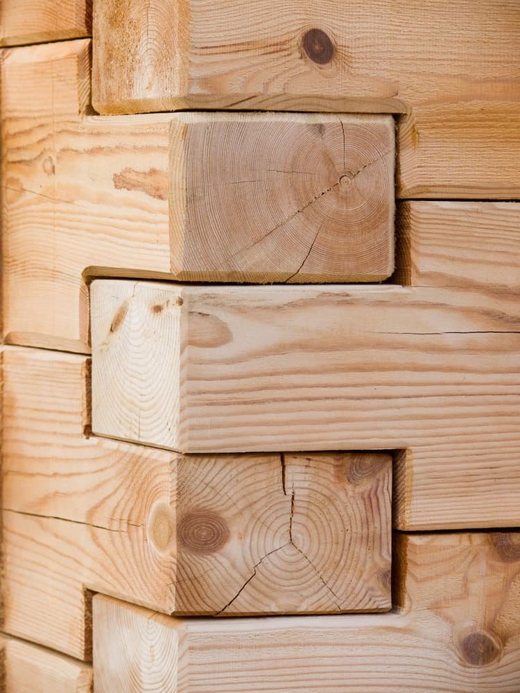 A corner of a wooden structure with lap joints.