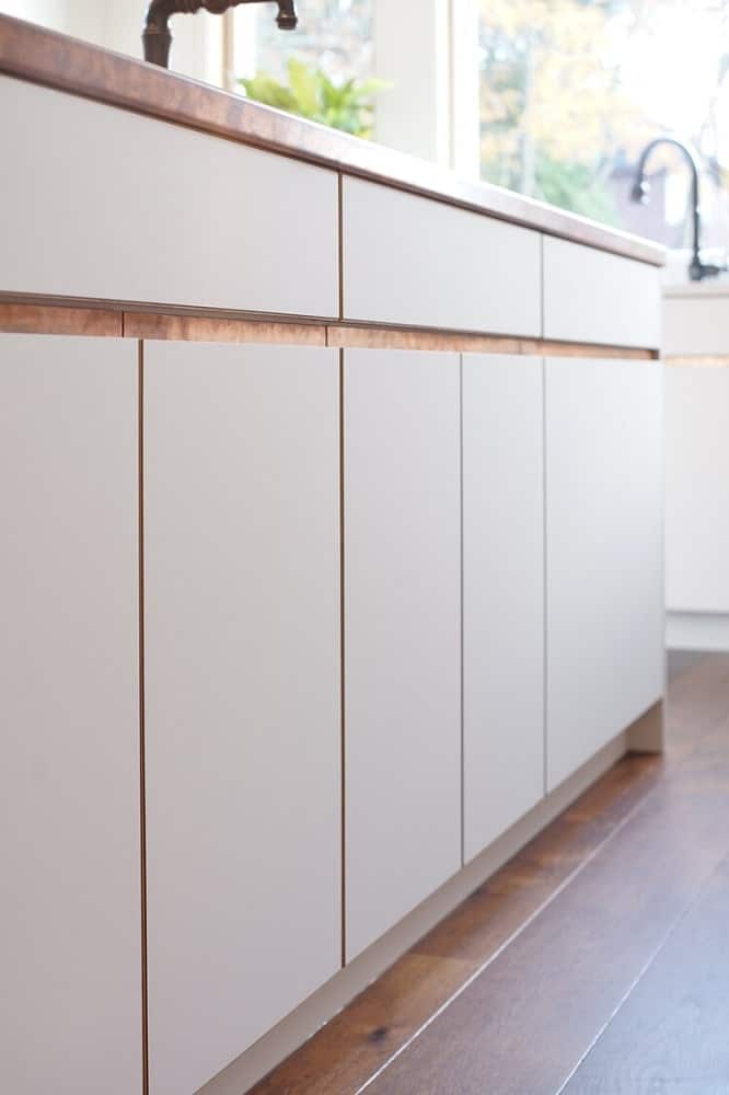 This is the cabinetry of the kicthen island that matches with the modern cabinetry of the rest of the kitchen.