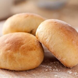 Pieces of potato bread on a wooden surface.