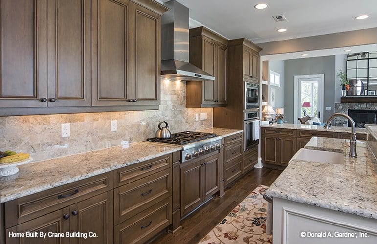 A closer look at the wooden cabinetry and center island.