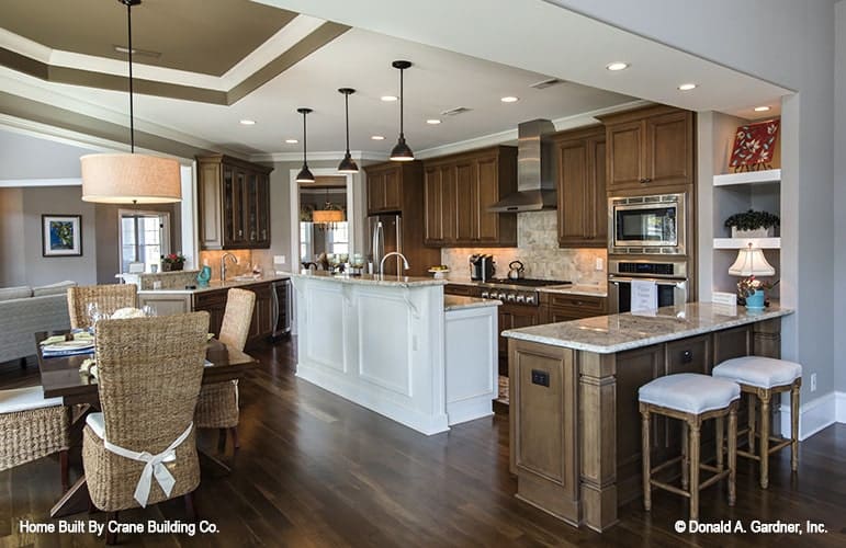 Across the kitchen is the breakfast nook crowned with a tray ceiling.