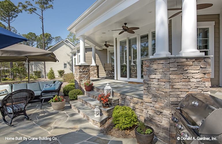 Angled view of the covered porch that transitions to the open patio.