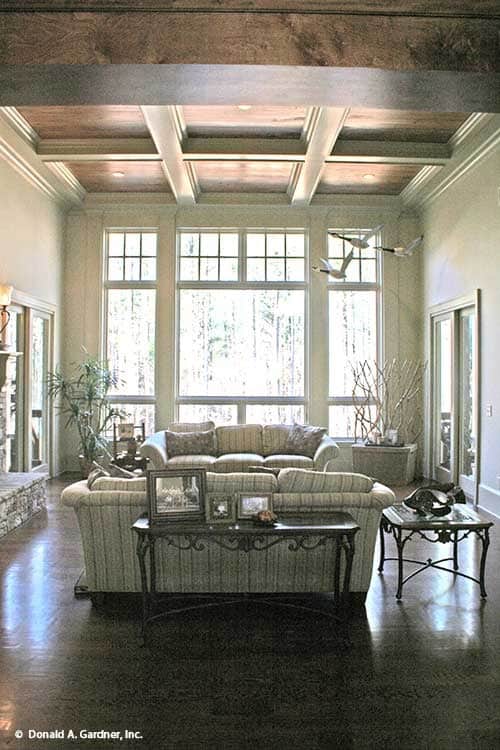 Inviting Living Room with Expansive Windows and Elegant Details