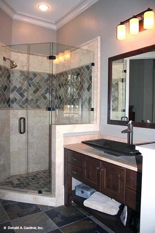 Elegant Bathroom with Geometric Tiled Shower and Dark Wooden Accents