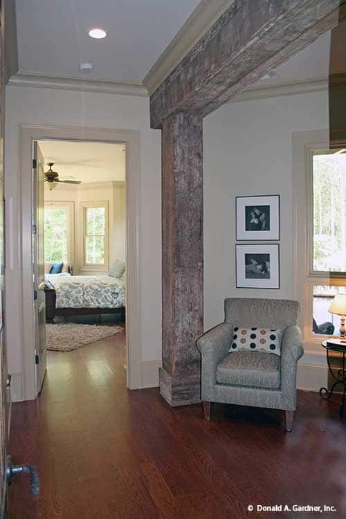 Inviting Hallway with Architectural Character Leading to Bright Bedroom