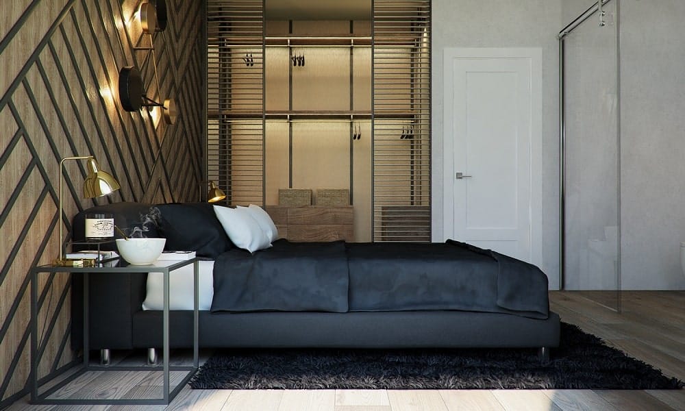 On the side of the large bed is a large closet with its own lighting and structures for storing clothes.