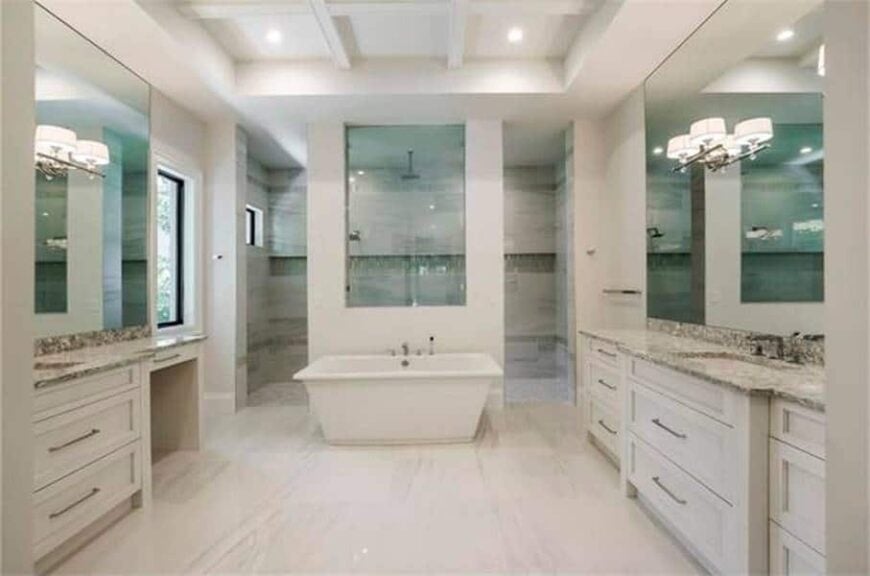 The primary bathroom is equipped with two vanities, a freestanding tub, and a walk-in shower.