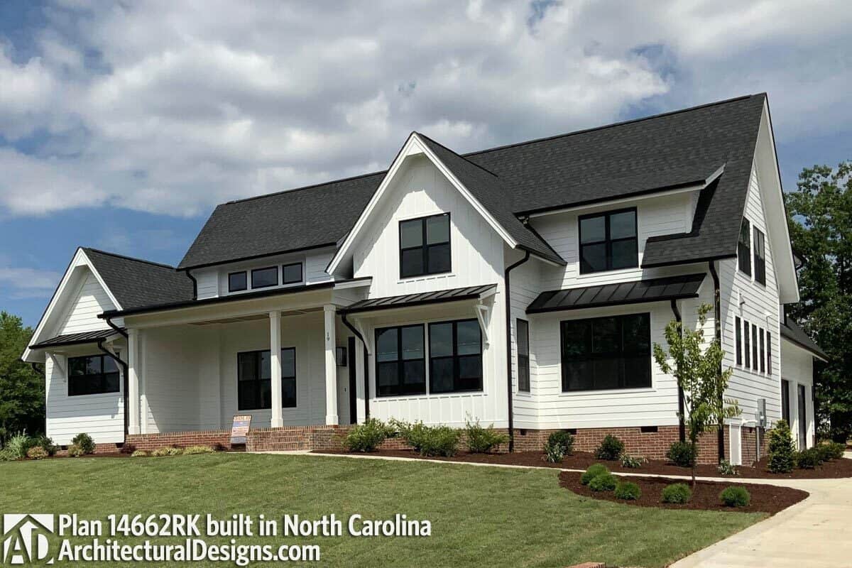 This home has a horizontal and vertical lap siding, brick bases, and tinted glass windows.