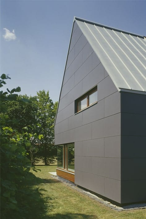 This is a closer look at the modern gray tone of the house complemented by the small window.