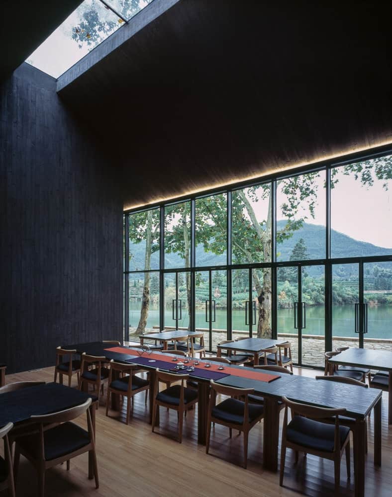 This large area also has a large skylight above that also brings balance to the dark walls.