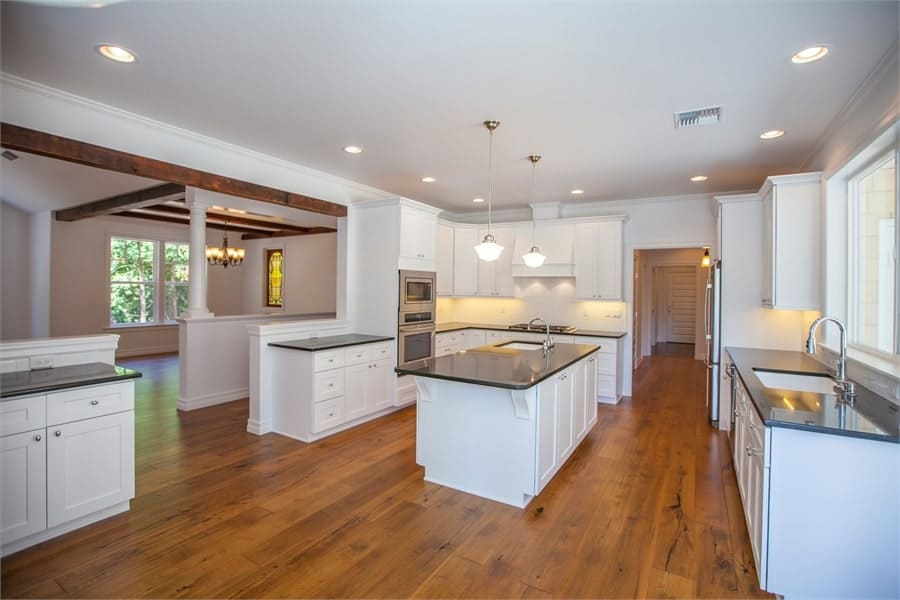 Sleek Kitchen Design with Central Island and Abundant Light