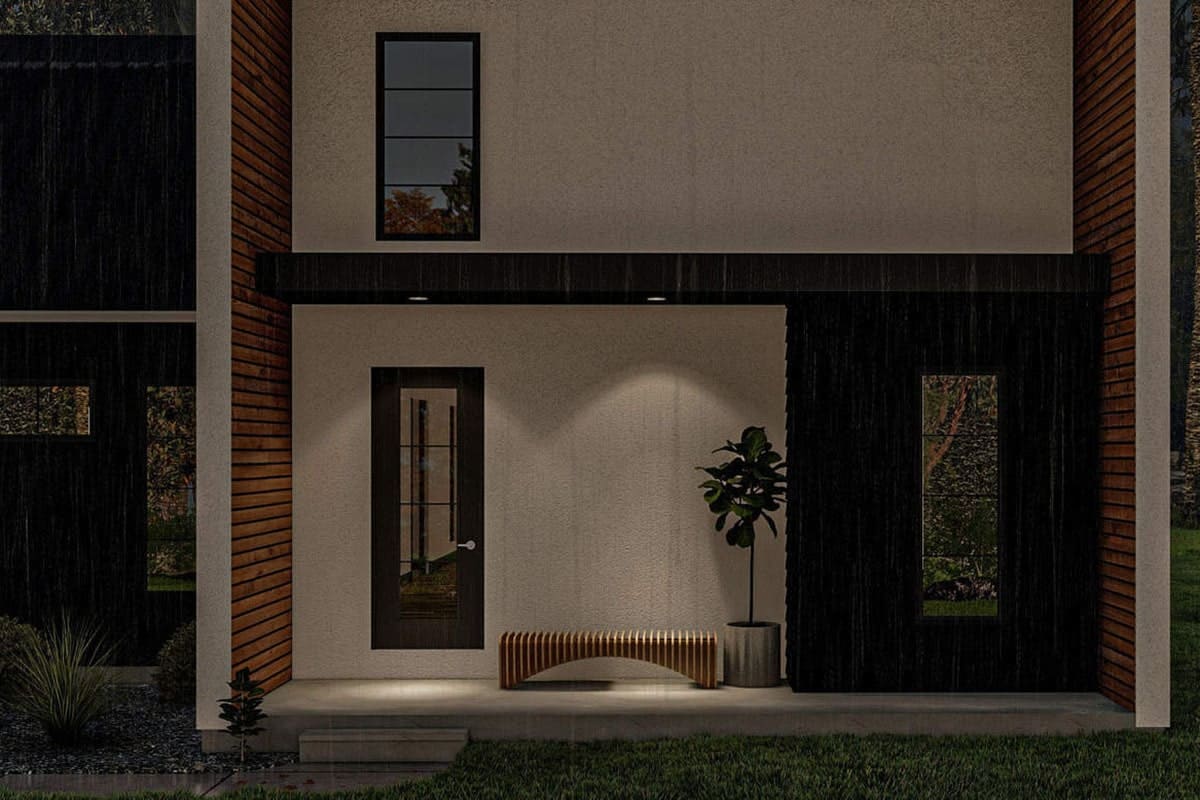A closeup look of the sleek entry porch with a wooden bench and a tall potted plant.
