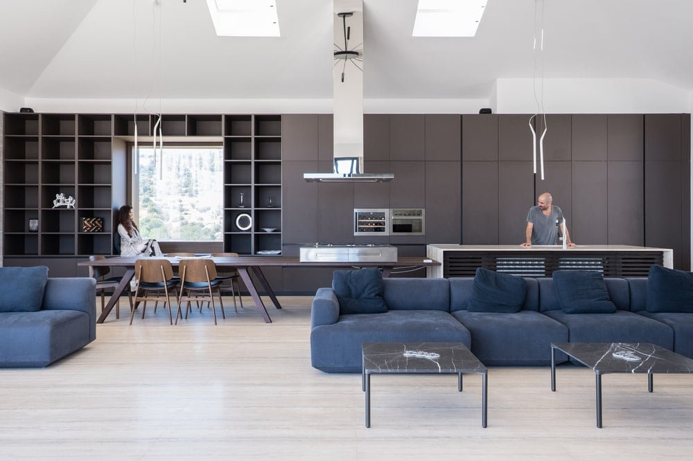 This is a look at the great room that houses the living room area, dining area and the kitchen.