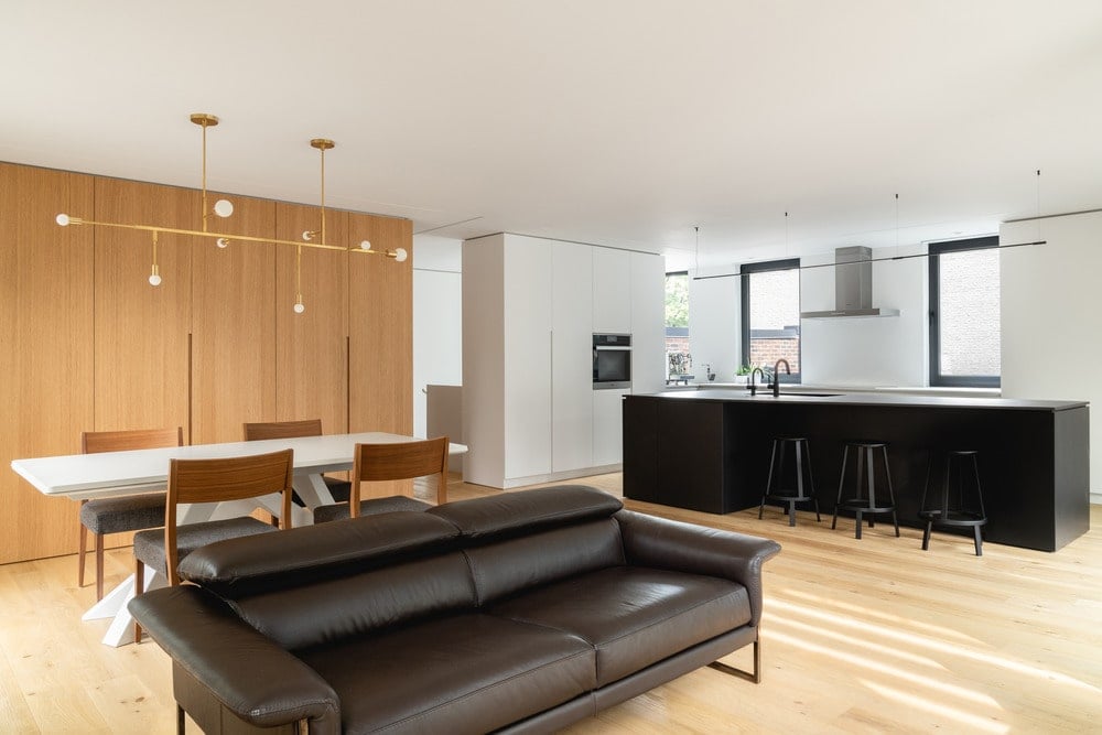 This is a view of the great room that houses the living room, dining area and kitchen area.