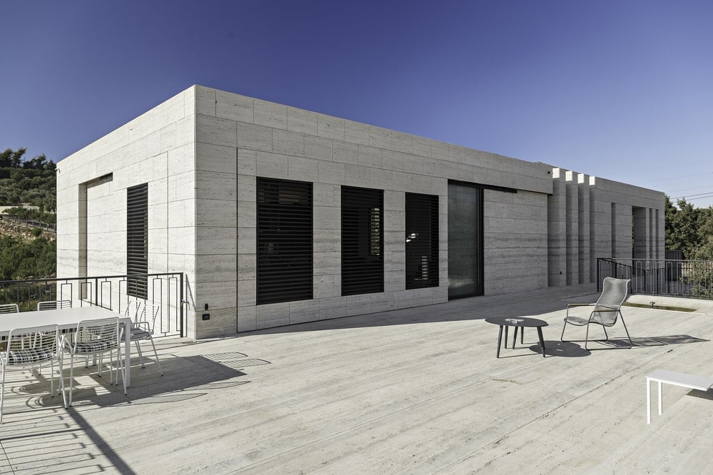 The doors have bars and the frames of the doors match perfectly with the exterior walls.