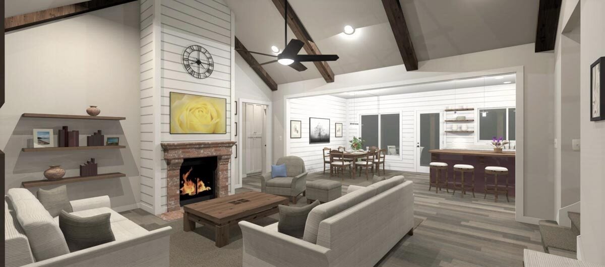 Living room with gray seats, wooden coffee table, a fireplace, and vaulted ceiling lined with rustic beams.
