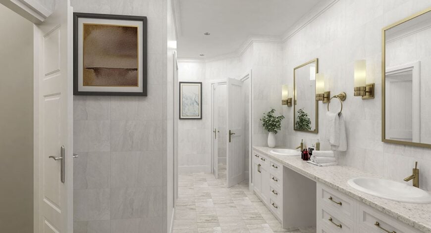 The primary bathroom features a dual sink vanity with a marble countertop and brass-framed mirrors.