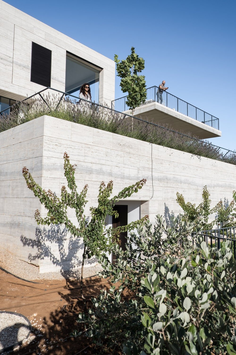 This is an exterior view of the house showcasing the two levels of balconies of the house.