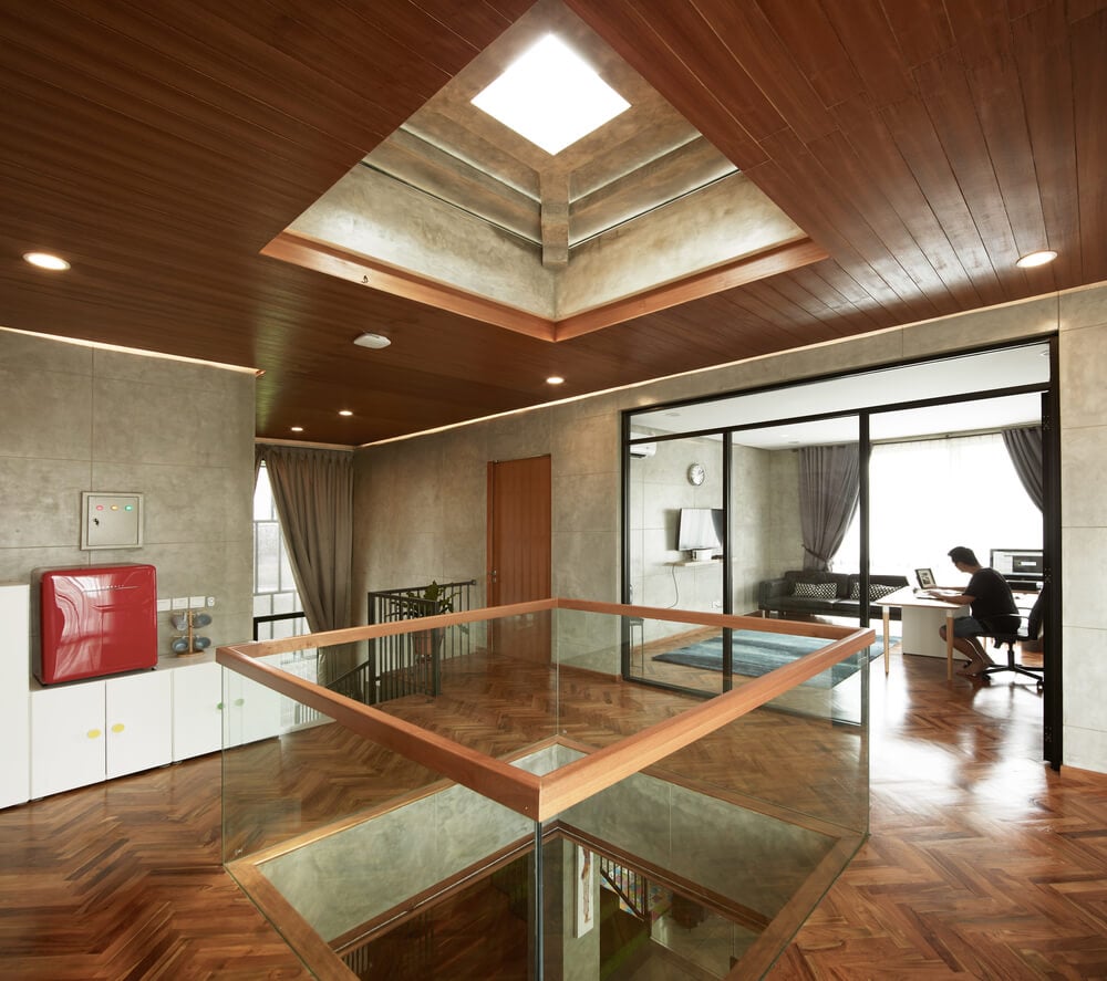 This is the indoor balcony over the living room with a skylight above and glass railings.