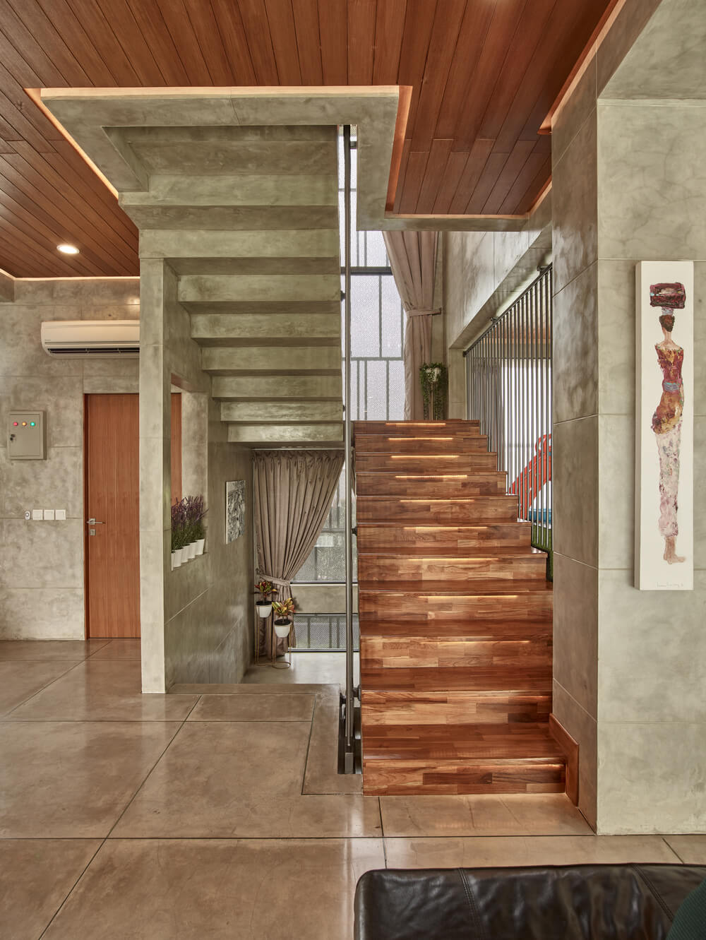 This is a view of the staircase from the vantage of the living room sofa.
