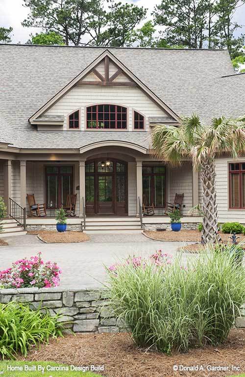 Home entry with a covered porch topped with a center gable.