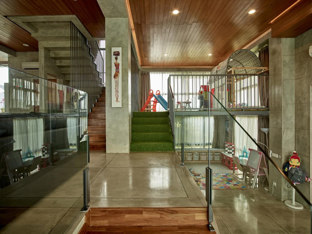 On the side of the foyer is the play room and above it is the child's other play area.
