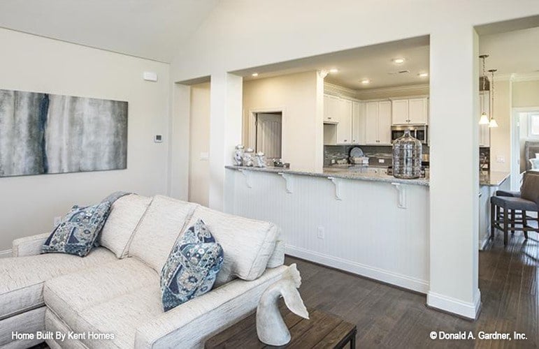 Inviting Living Room with Artful Accents and Open Kitchen