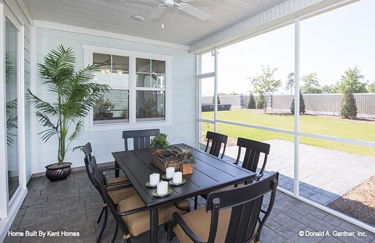 Inviting Screened Porch with Elegant Dining Setup