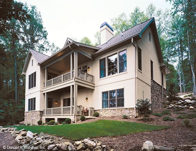 Rear exterior view showing the stone accents and covered porches.