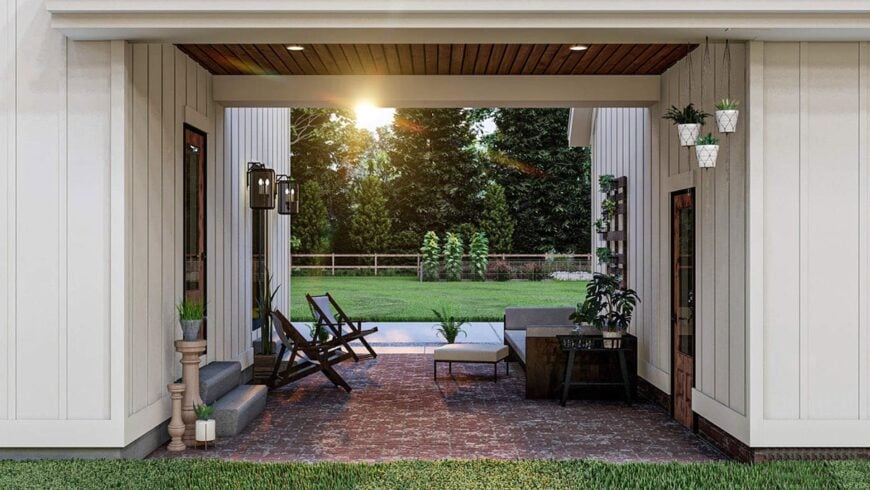 Rear patio with wooden seats connecting the garage to the main house.