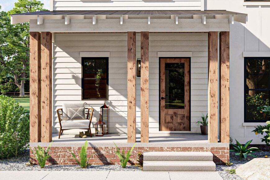 Entry porch with a cushioned seat, double columns, brick base, and a concrete stoop.