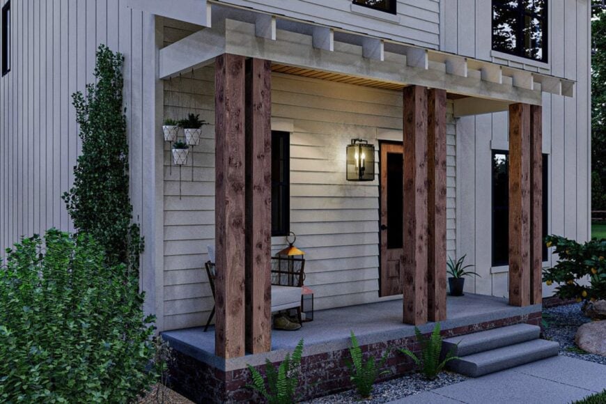 Night view of the entry porch showing its ambient glow from the outdoor sconce.