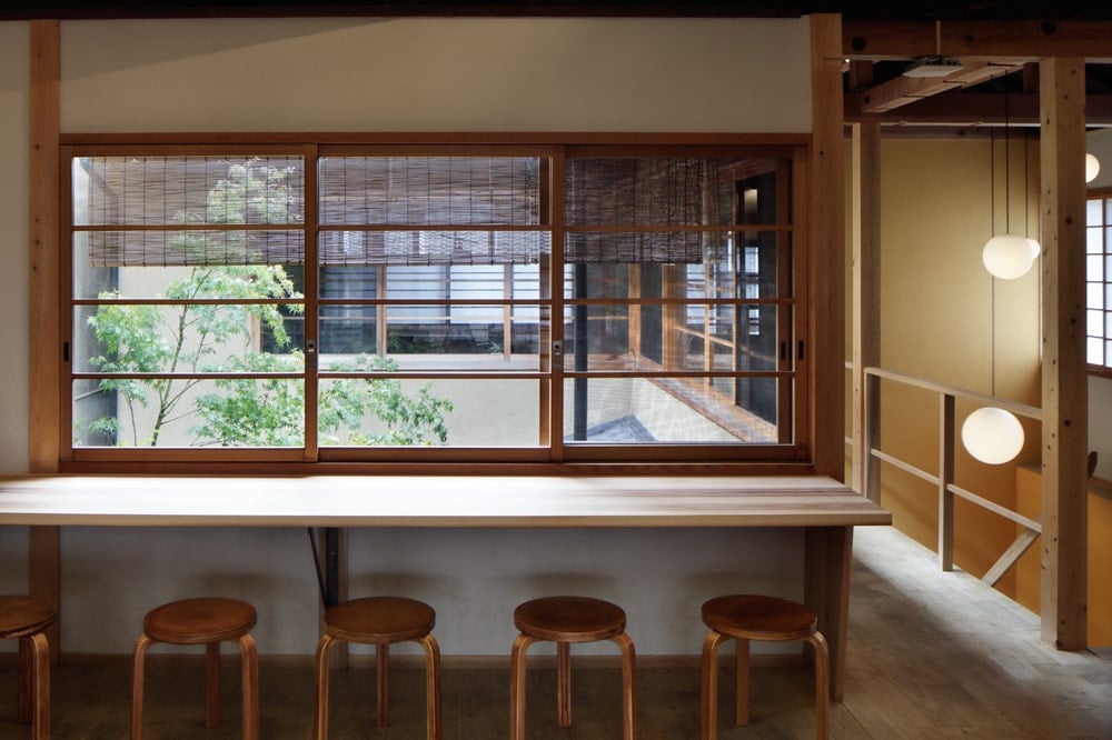 This area has a bar area and a built-in wooden table under the window.