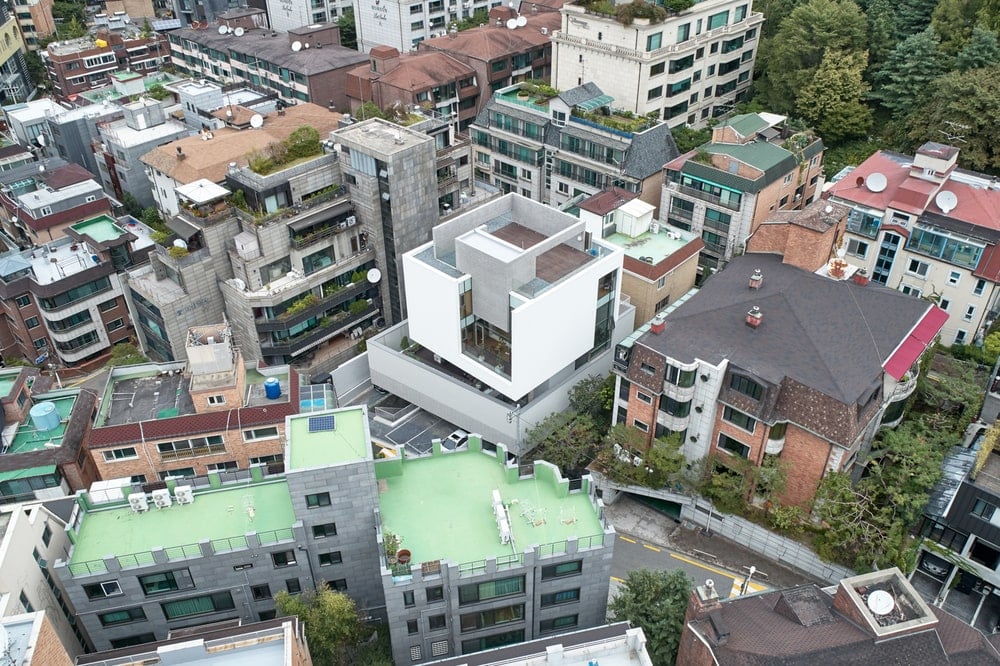 This is an aerial view of the building showcasing its unique shape that makes it stand out against the surrounding structures.