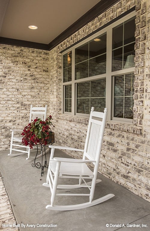 Welcoming Porch with Classic Rocking Chairs and Floral Accents