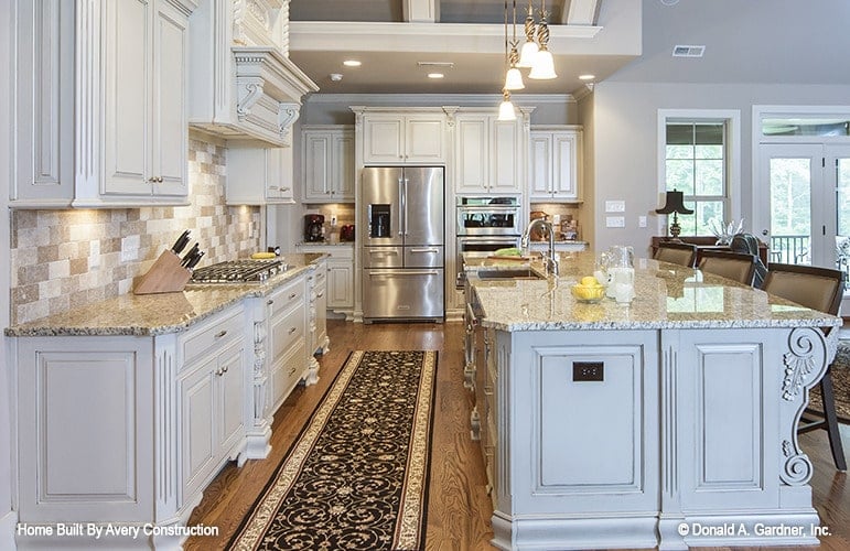 Spacious Kitchen with Granite Island and Light-Filled Ambiance