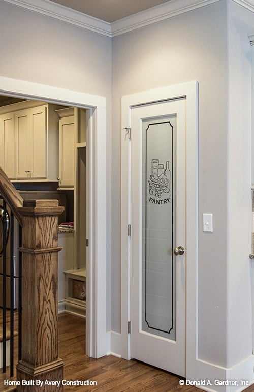 Inviting Kitchen Entryway with Etched Pantry Door