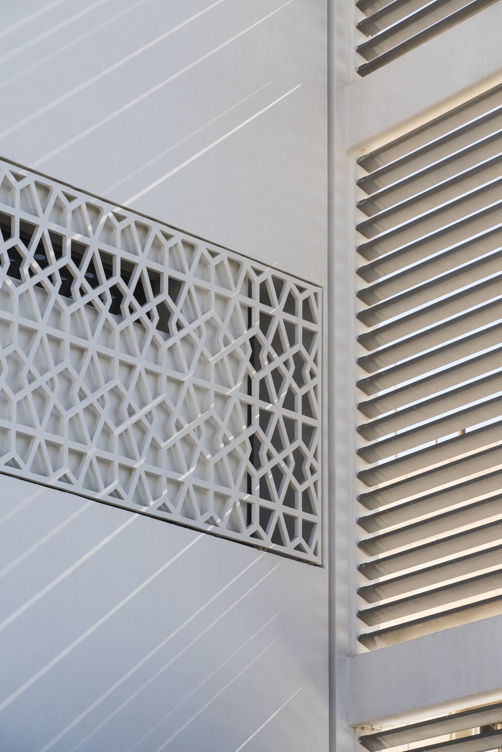 This is a close look at the intricate patterned panels of the house exterior walls giving the house an additional textured layer.