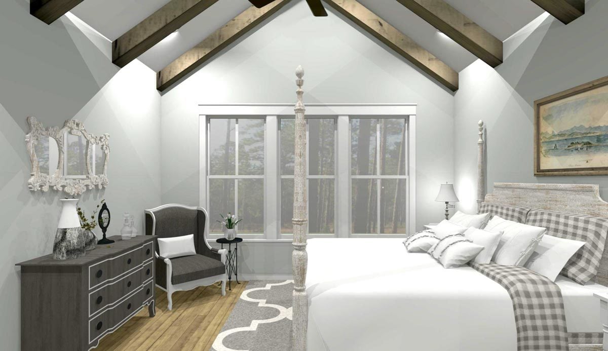 Primary bedroom with a four-poster bed, an upholstered chair, dark wood dresser, and a cathedral ceiling lined with exposed beams.