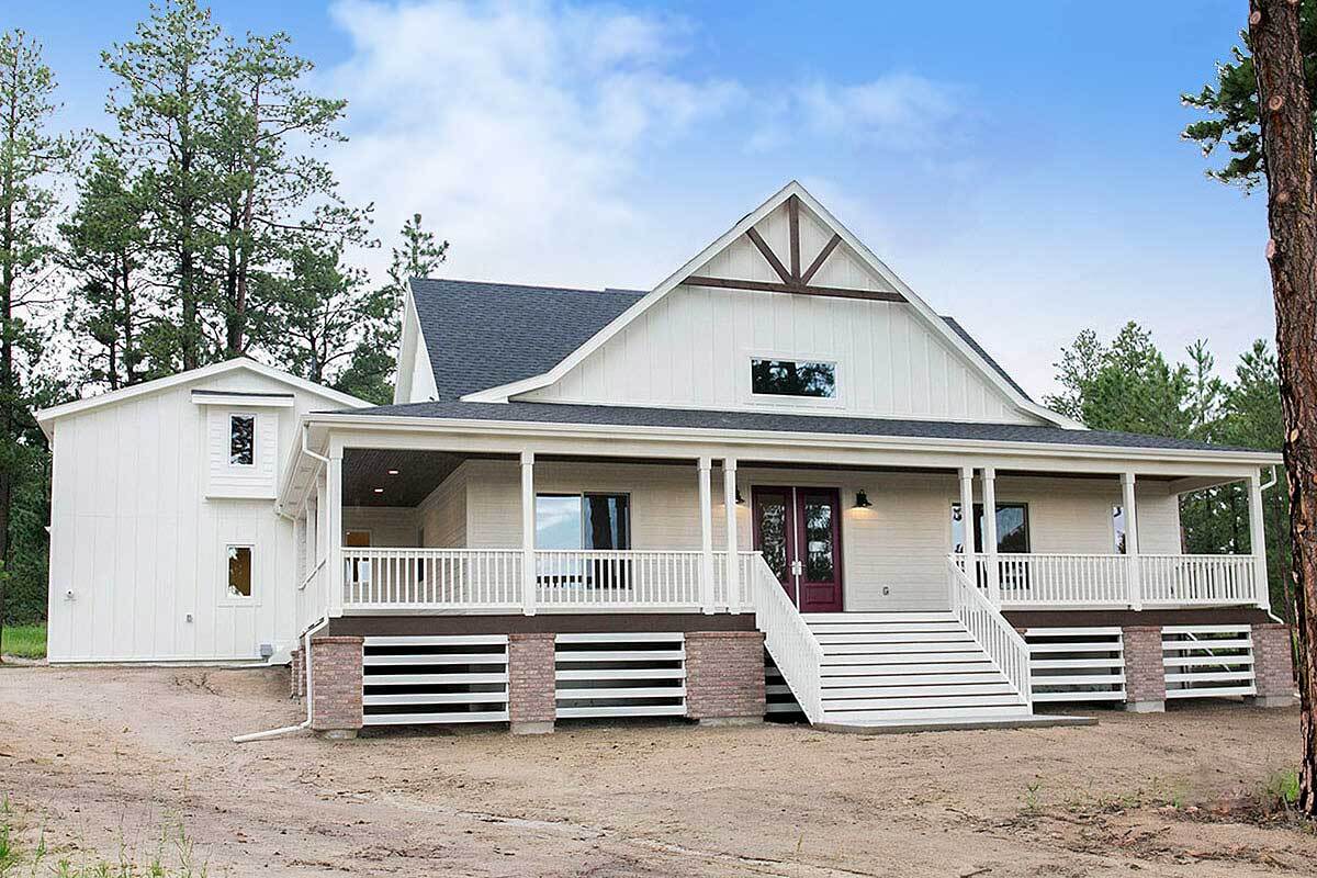 Two-Story White Exterior with Symmetrical Porch Design