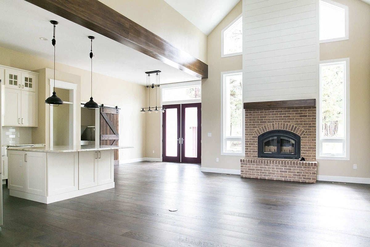 Inviting Living Area with High Ceilings and Warm Tones