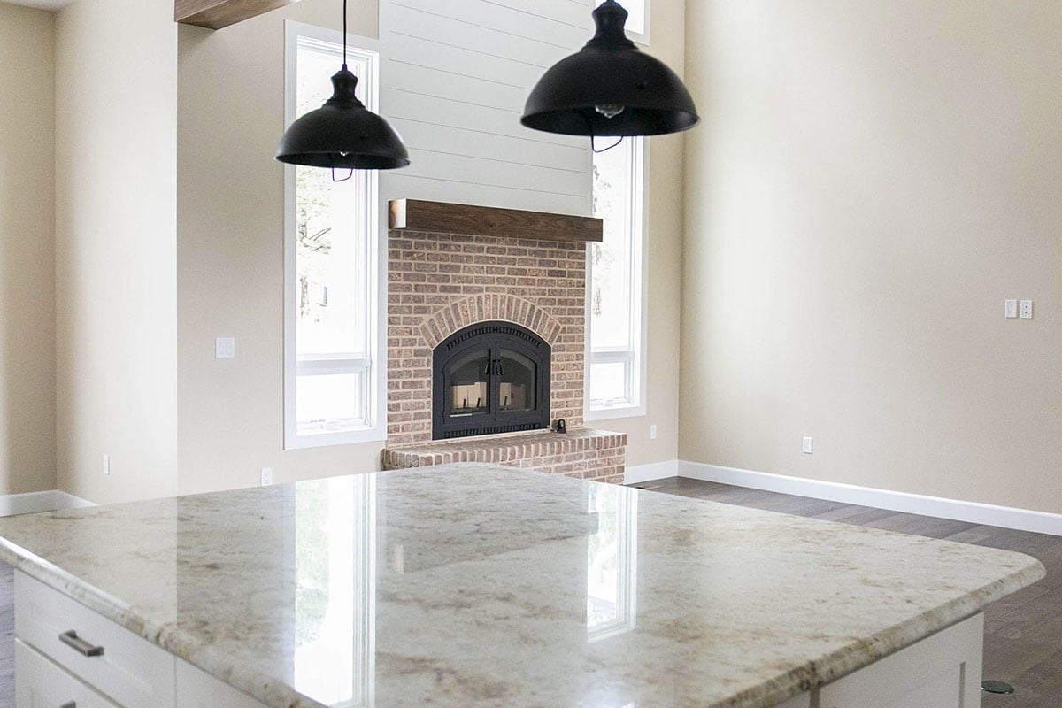 Contemporary Kitchen with Industrial Accents and Fireplace Feature