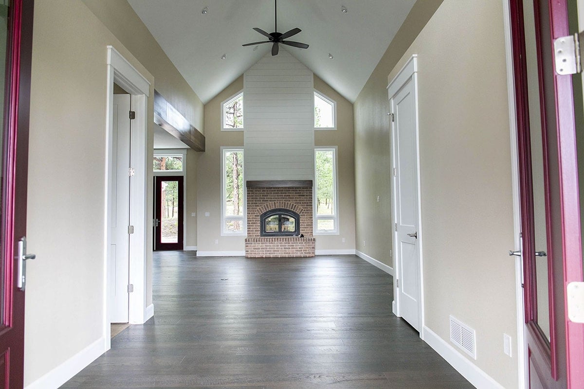 Light-Filled Living Room with Vaulted Ceilings and Fireplace