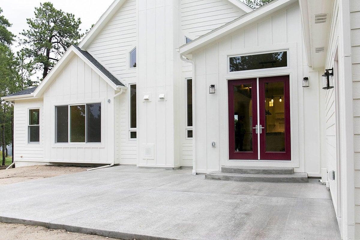 Vertical Panel Design and Maroon Entrance Doors Shine