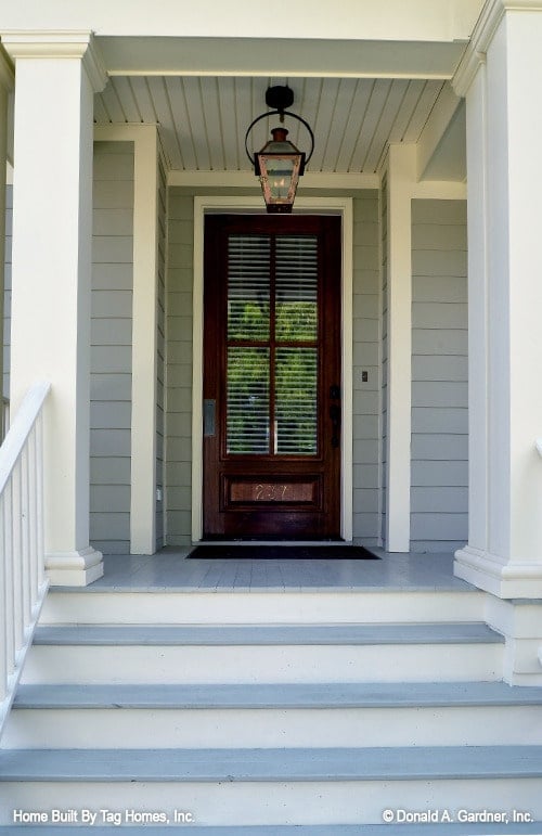 Welcoming Entryway with Glass-Paneled Wooden Door