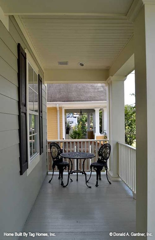 Inviting Porch Featuring Elegant Black Metal Furniture