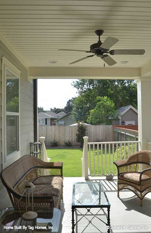 Inviting Porch with Cozy Wicker Seating Area